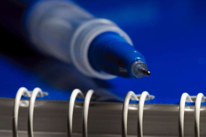 a pen resting on a notebook